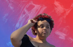Image of young adult with sunglasses on head confidently looking upward/away with a red/blue/pink background